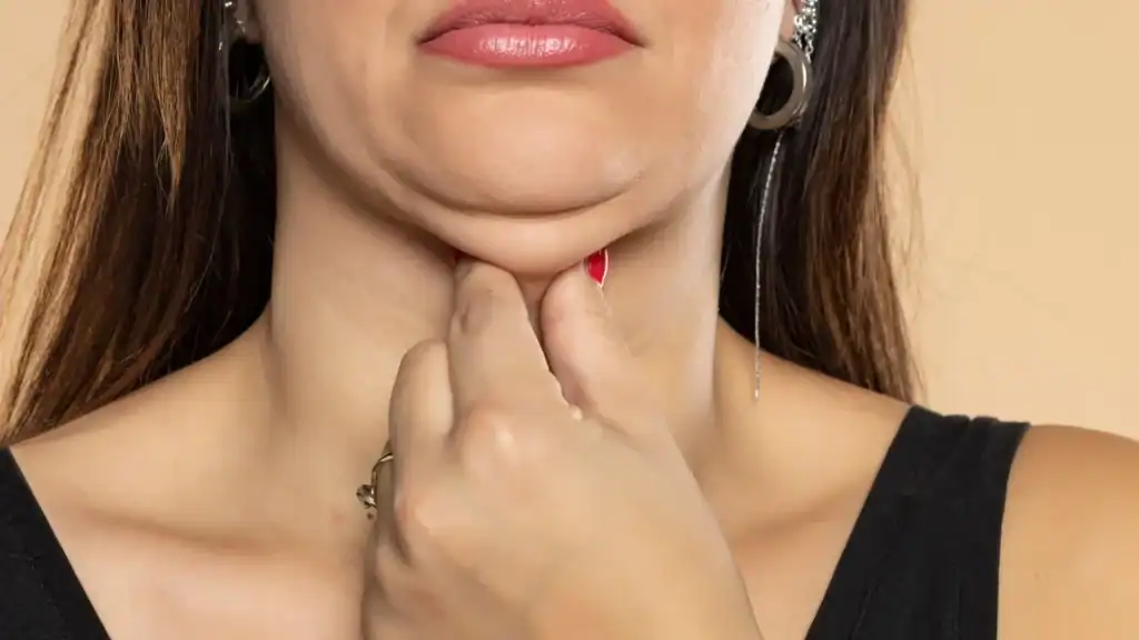 An image of a woman with double chin, sad, worried : Non Surgical Double Chin Removal Treatment in Langside, UK